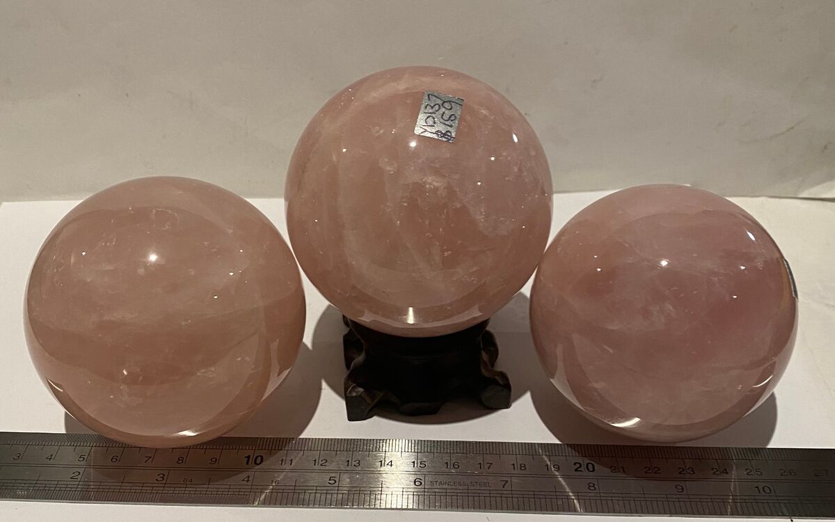 Three rose quartz spheres